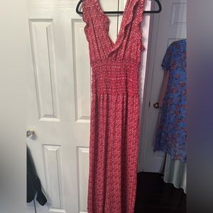 Beautiful red jumpsuit/size medium/ small tear but not noticeable while wearing